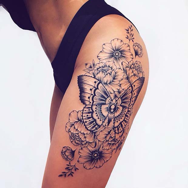 Tetovanie na motýľových stehnách s kvetmi